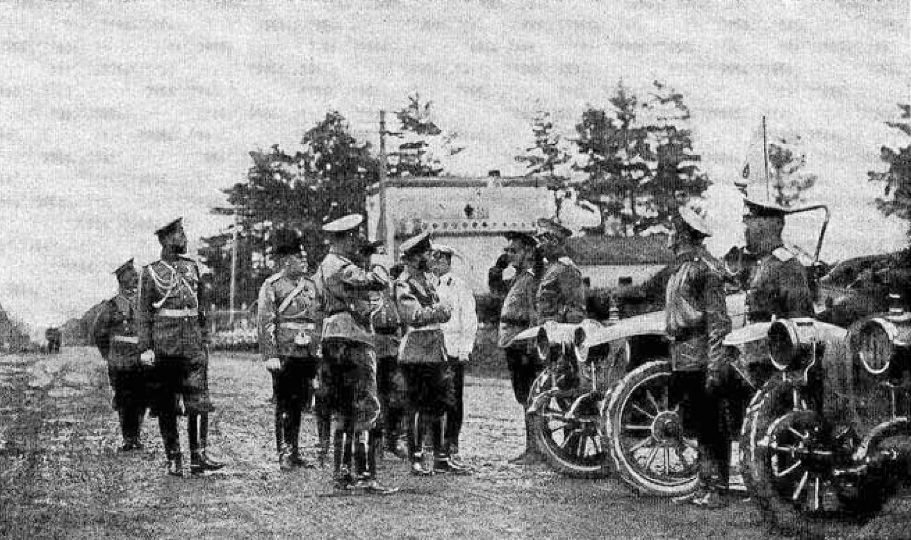 Officials inspect a line of Russo-Balt automobiles in 1912, archive photograph