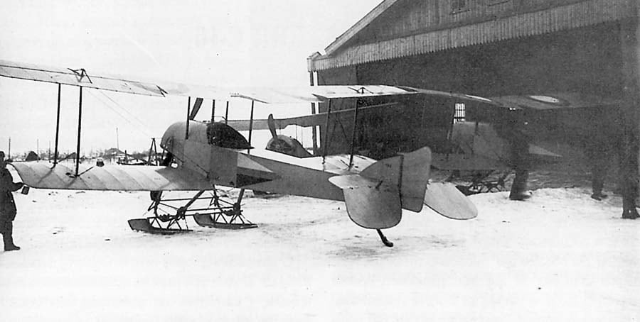 S-16 fighters near a factory hangar