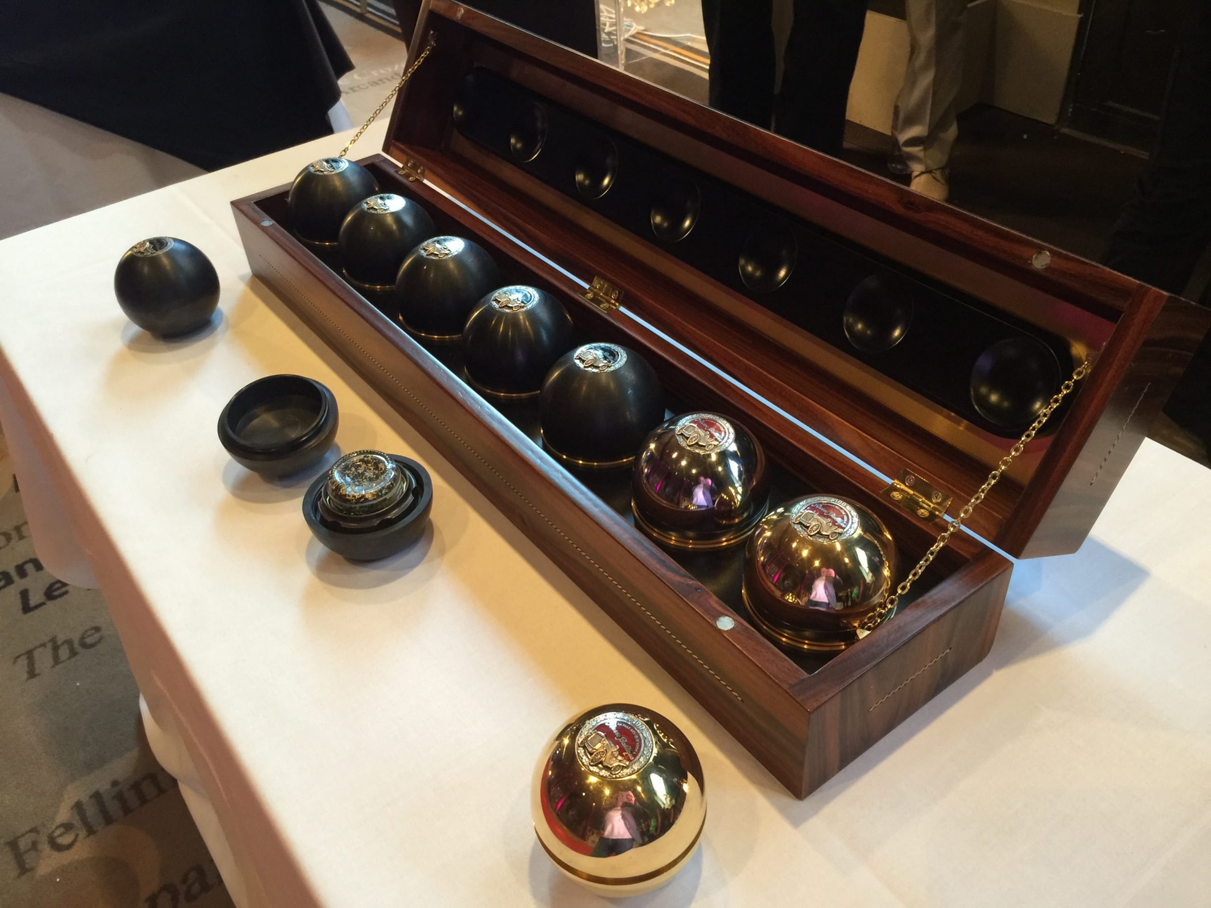 RussoBaltique caviar spheres in an open walnut presentation case at the Cannes Film Festival Auction 2015, Hôtel Barrière Le Majestic