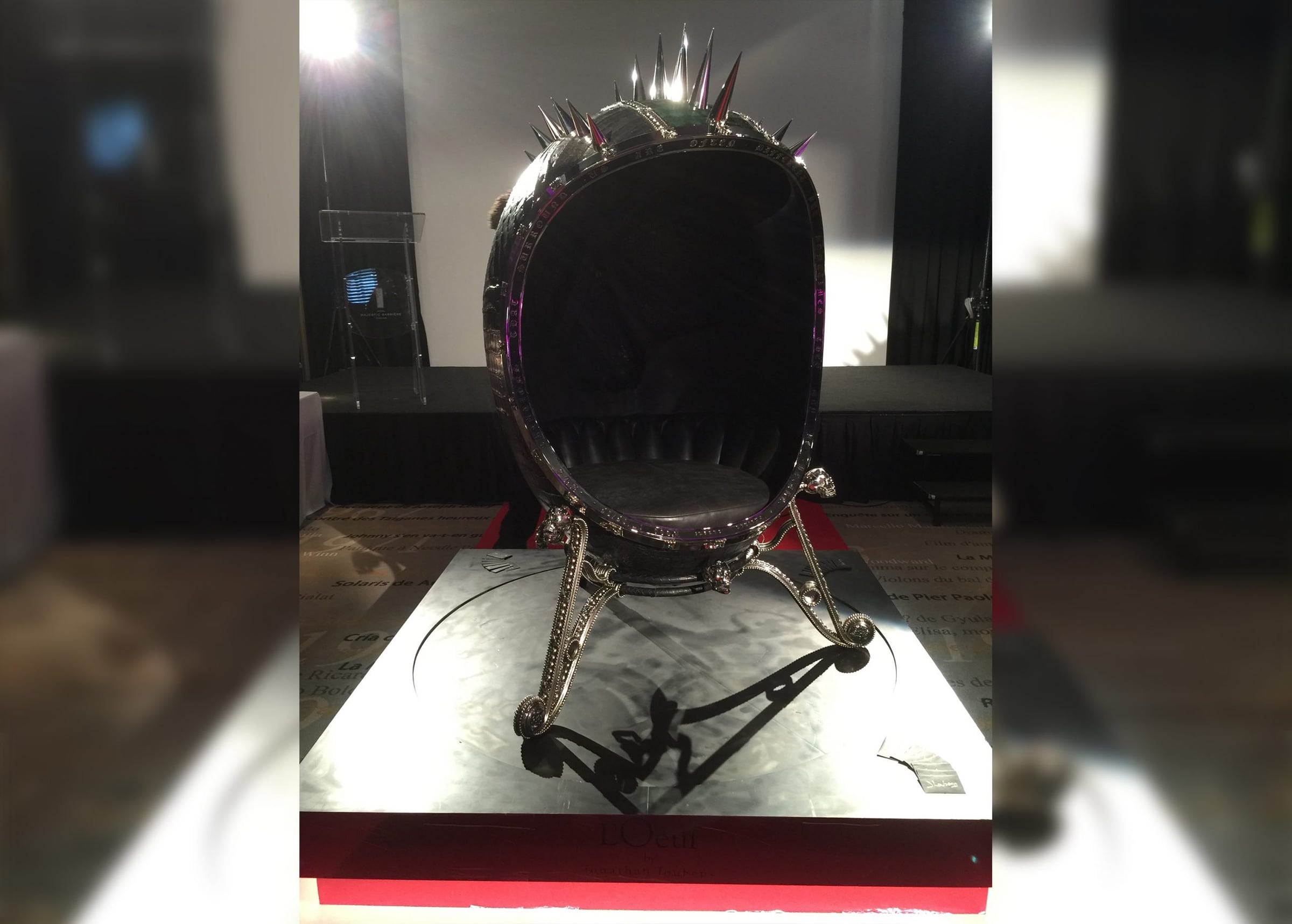 Spiked sculpture chair on a white plinth