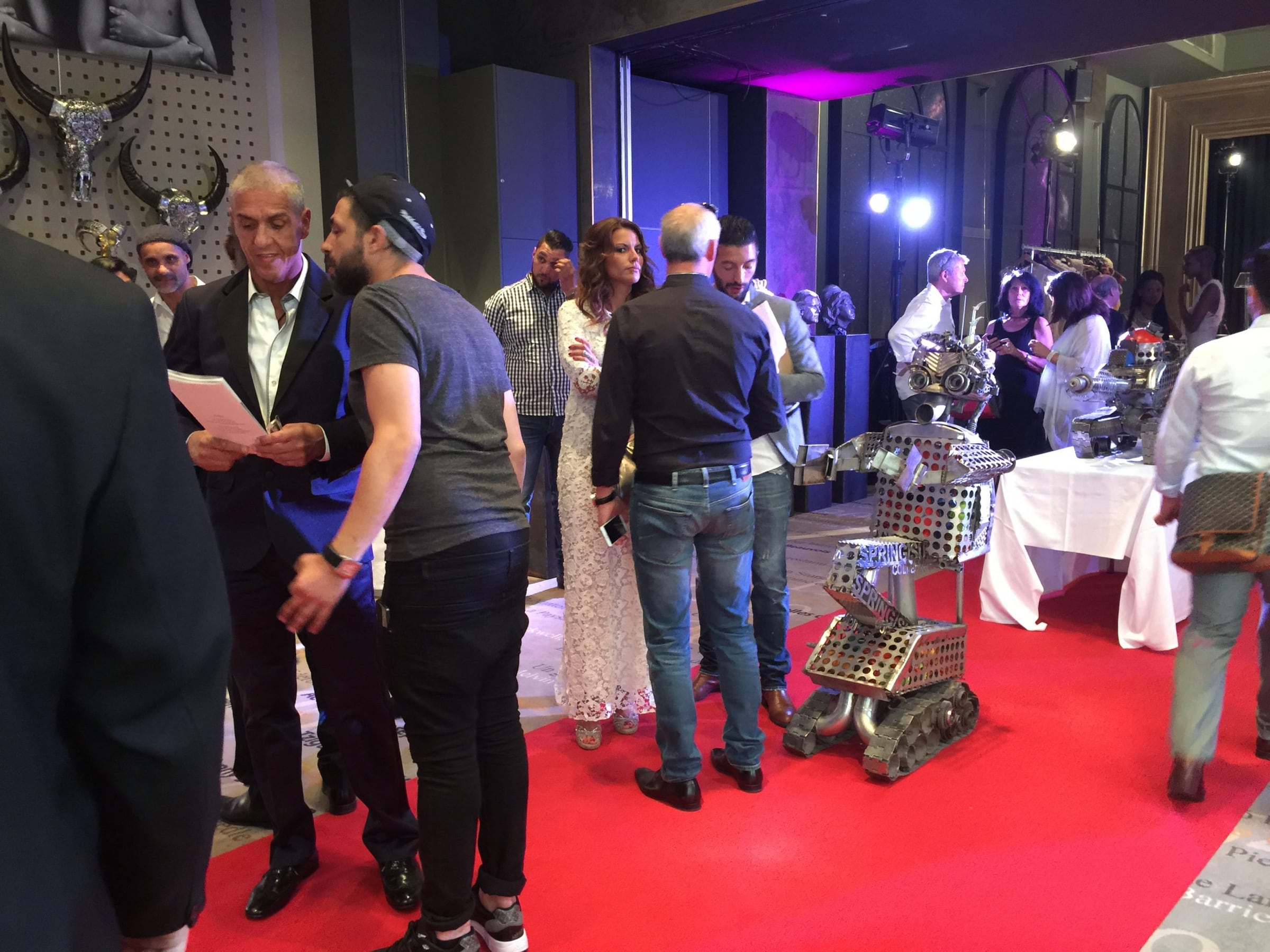 Guests viewing the auction lots on the red carpet at the Cannes Film Festival Auction 2015, Hôtel Barrière Le Majestic