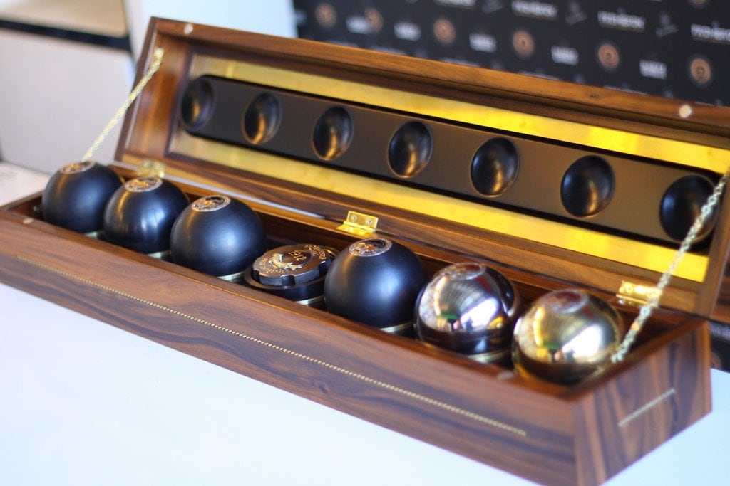 Black and gold RussoBaltique Imperial Prix 1912 caviar spheres in a walnut case