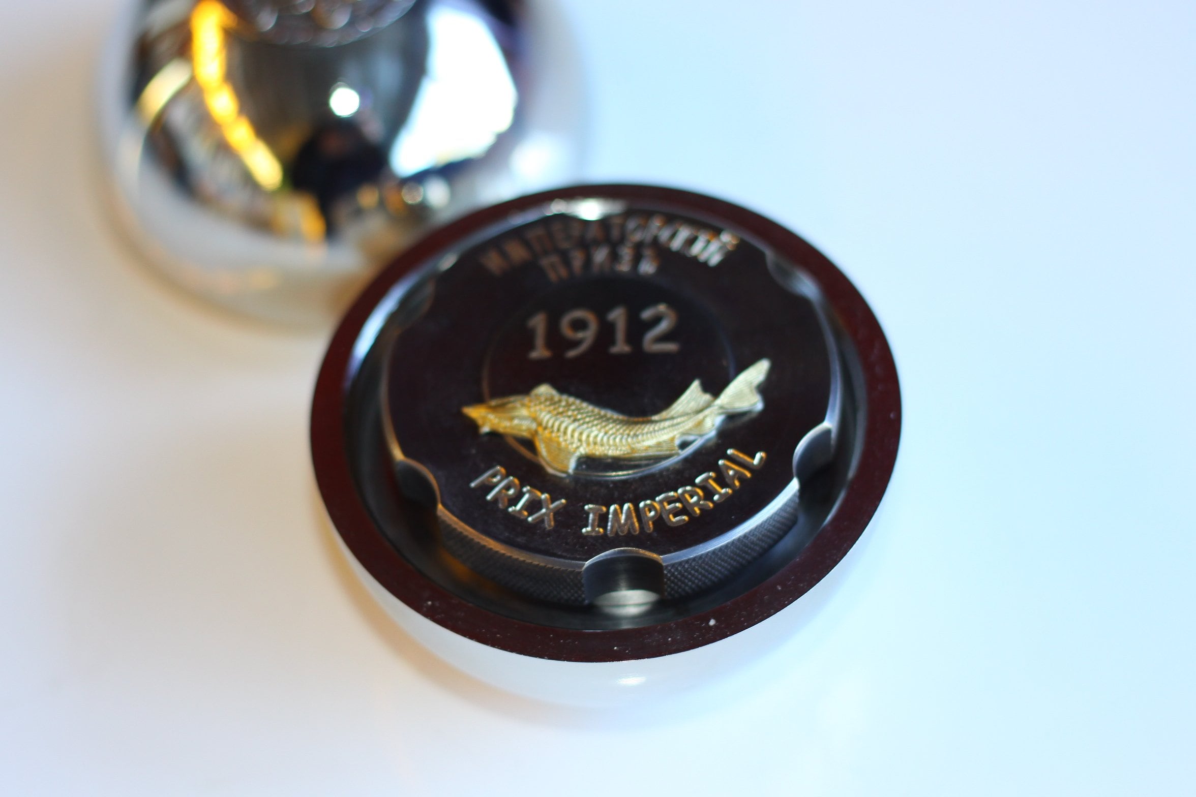 RussoBaltique Imperial Prix 1912 caviar tin with a gold sturgeon
