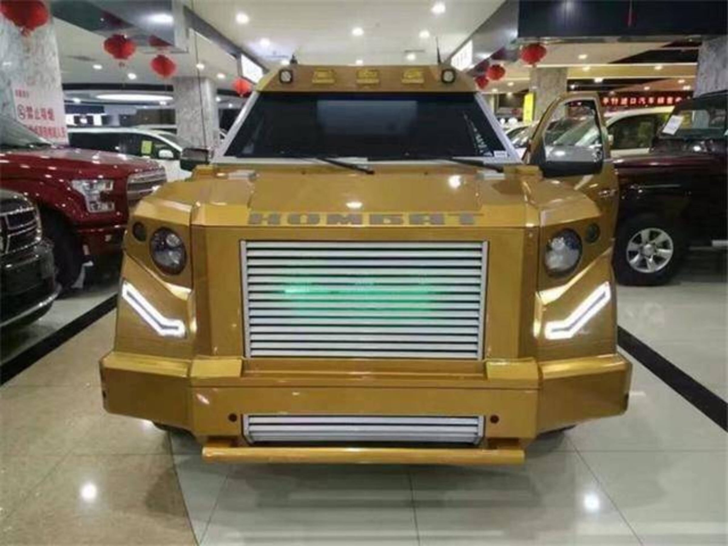 Gold DARTZ Prombron’ in a Chinese showroom hung with red lanterns