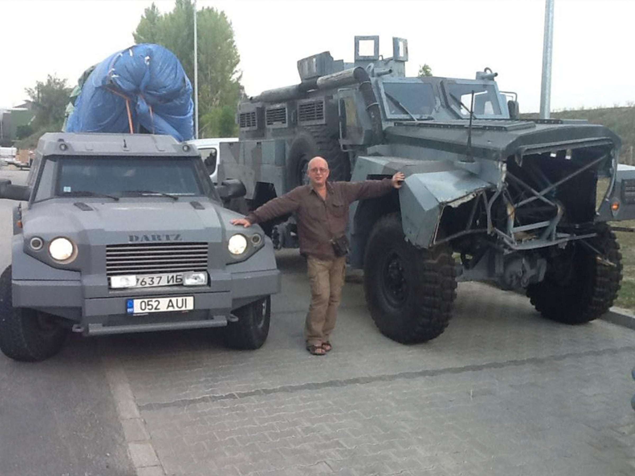 A grey DARTZ Prombron’ and the MRAP stunt truck from A Good Day to Die Hard parked together