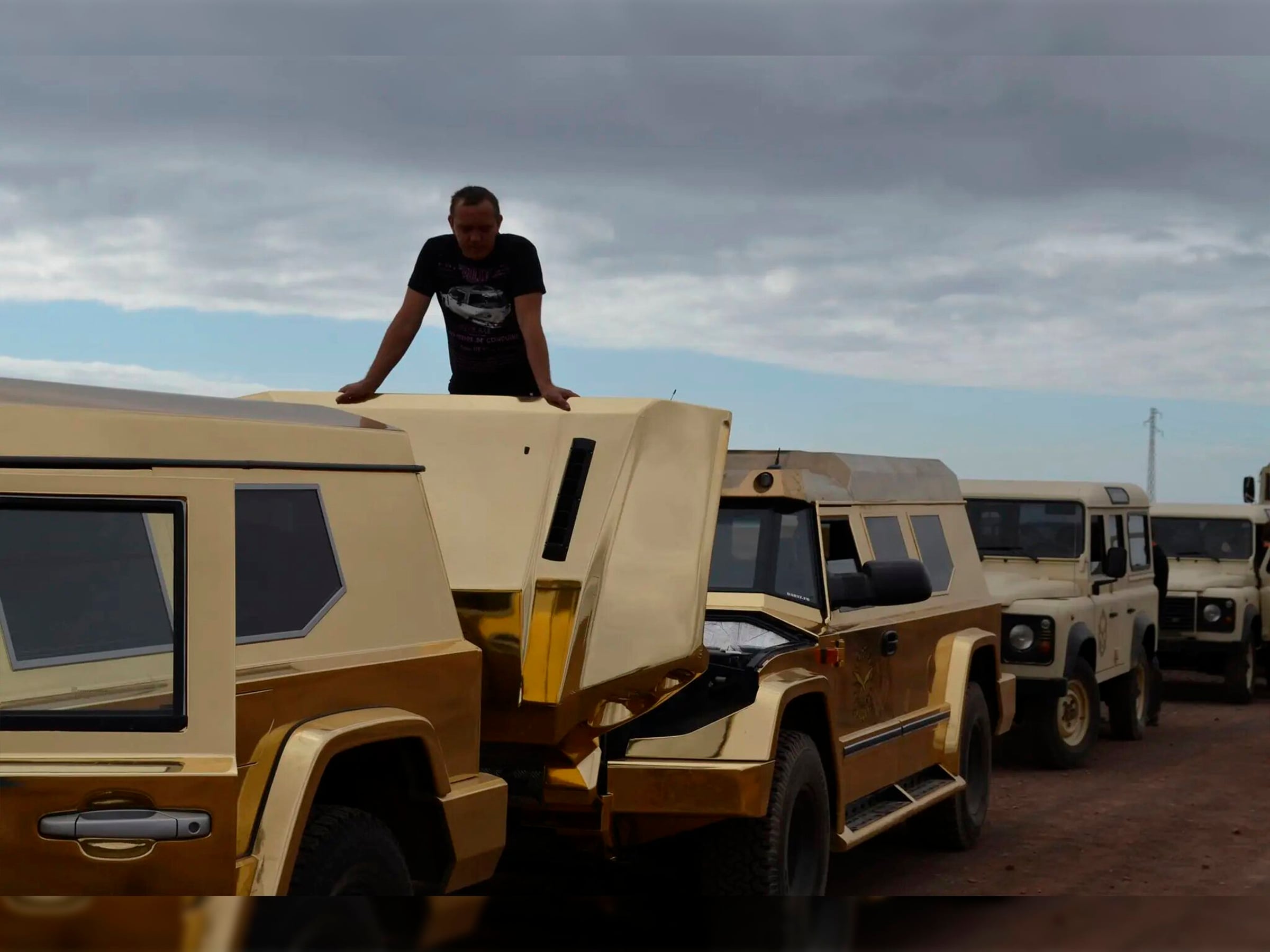 Fleet of gold DARTZ Prombron’ cars lined up for The Dictator