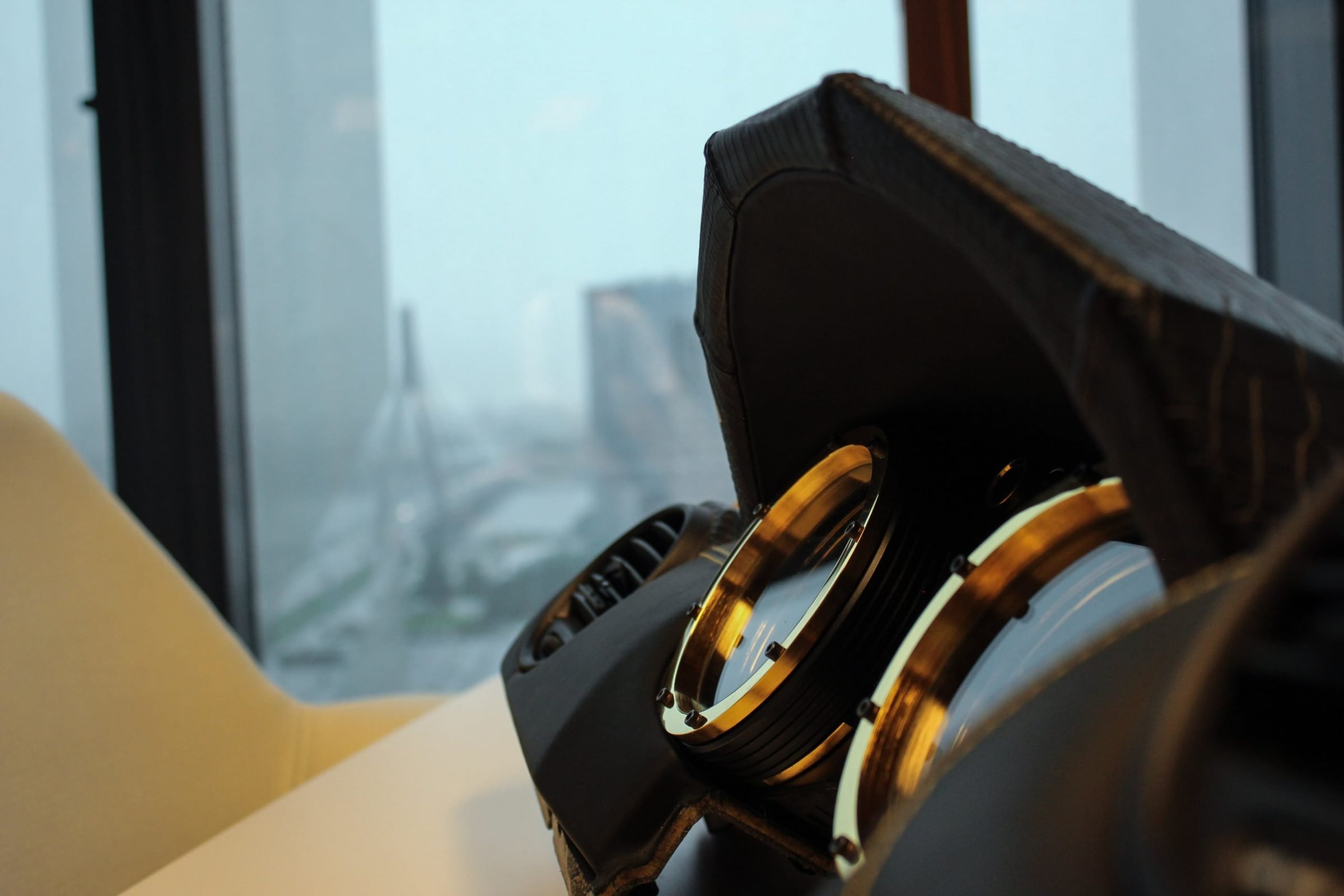 Crocodile-leather DARTZ dashboard with gold-ringed dials, overlooking Riga