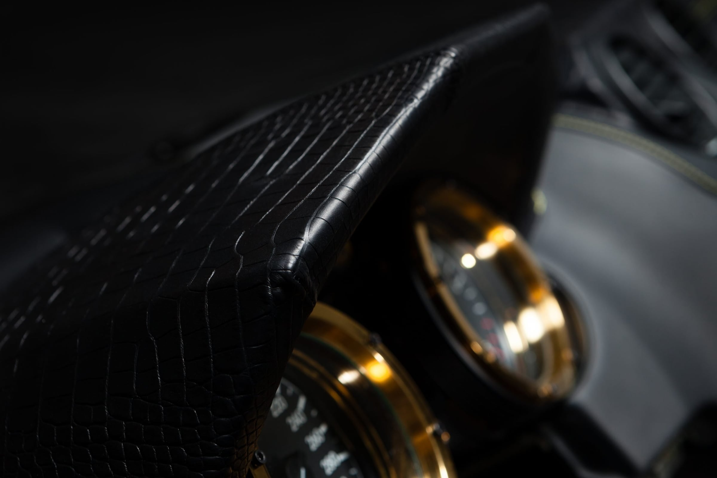Crocodile-leather DARTZ dashboard hood over gold-ringed dials